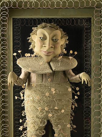 Froggy Moore green impish puppet with wide collar framed with curly wire work